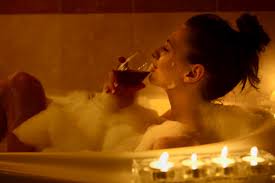 lady with wine in tub