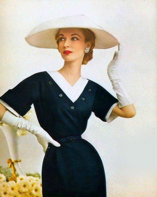 all things clothing and apparel  woman in hat and black dress with white collar